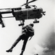 A U.S. Air Force parajumper hanging below a Kaman HH-43B/F Huskie in South-East Asia, in the 1960s.